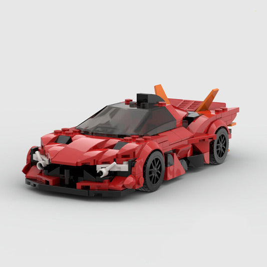Red sports car model made of interlocking bricks on a light gray background