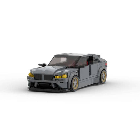 Gray car model made of interlocking bricks on a white background